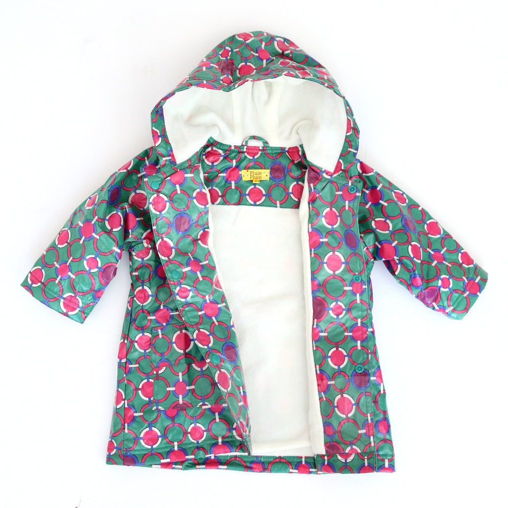 Green hooded raincoat with circular chain print, cream lining visible at opening