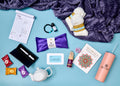 Recovery box contents with purple pouch, white socks, beaded bracelet, black box, tea infuser