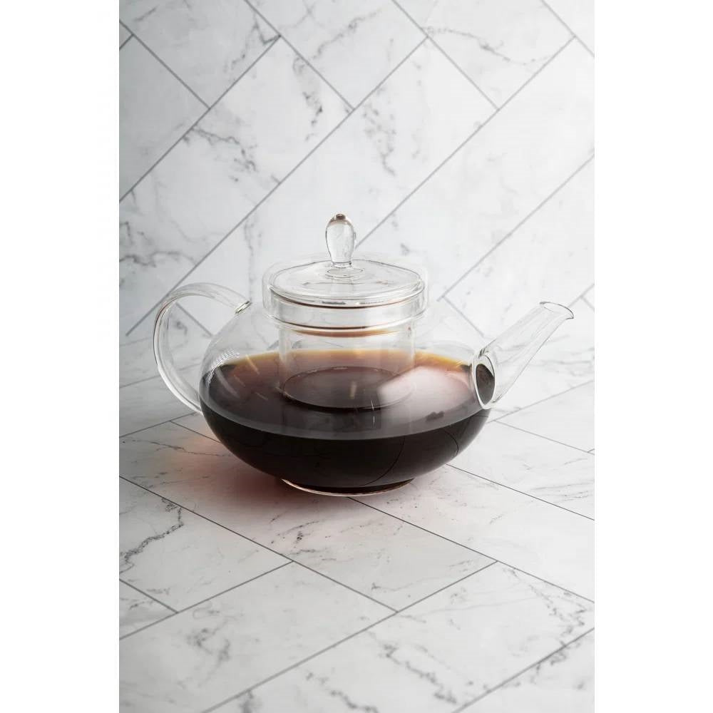 Borosilicate glass teapot with removable infuser, clear lid, handle, spout; dark tea inside