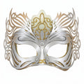 Ornate gold and silver masquerade mask with filigree cutouts for eyes and nose