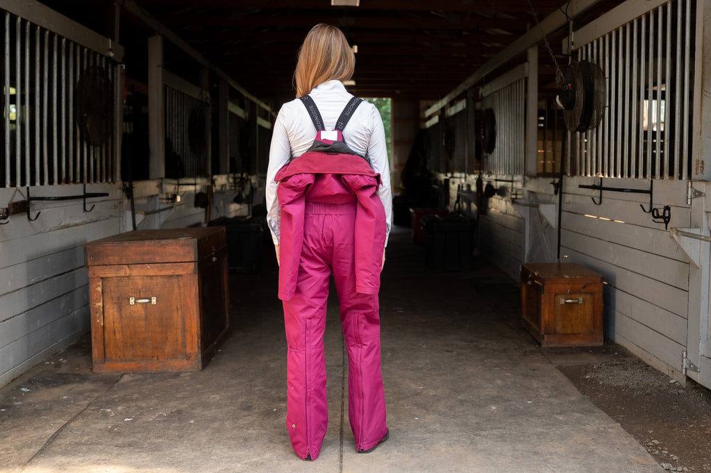 Raspberry insulated hooded jumpsuit back view with hood and long straight legs