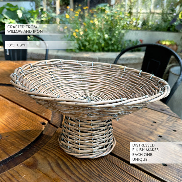 Round woven willow riser basket with wide rim and distressed finish on patio table
