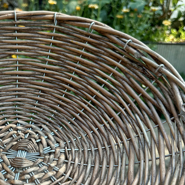 Close-up of the round woven willow riser basket weave with tight crisscross pattern