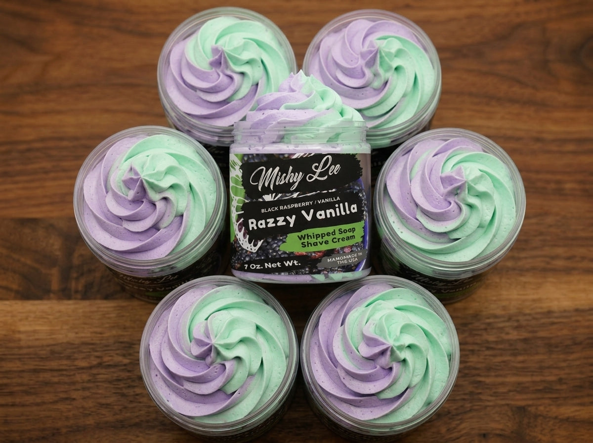 Set of small whipped soap jars with purple and mint swirl tops on wood