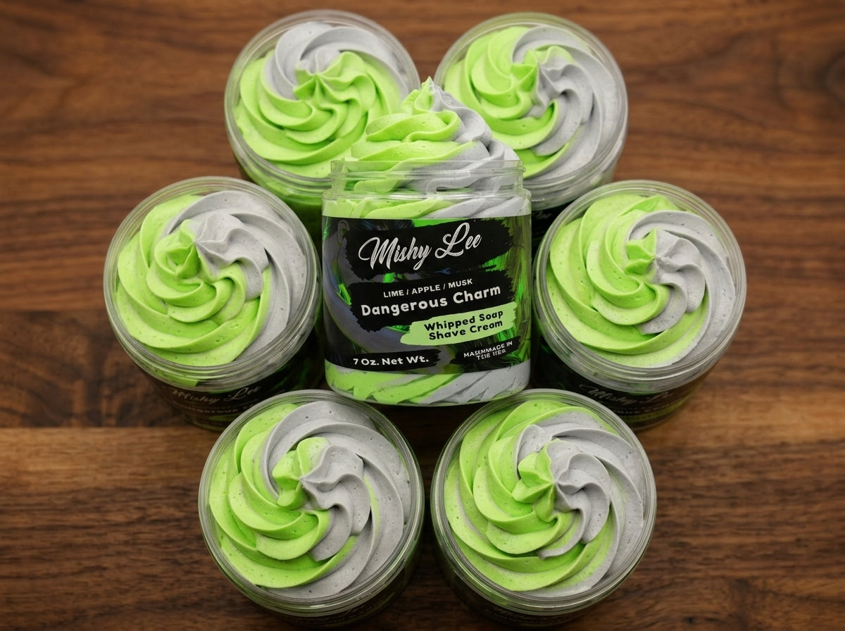 Set of small whipped soap tubs with green and gray swirl tops around main jar