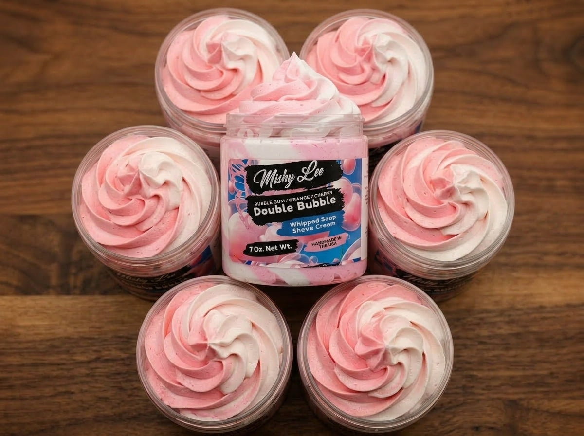 Several small whipped soap tubs with pink-and-white swirl tops