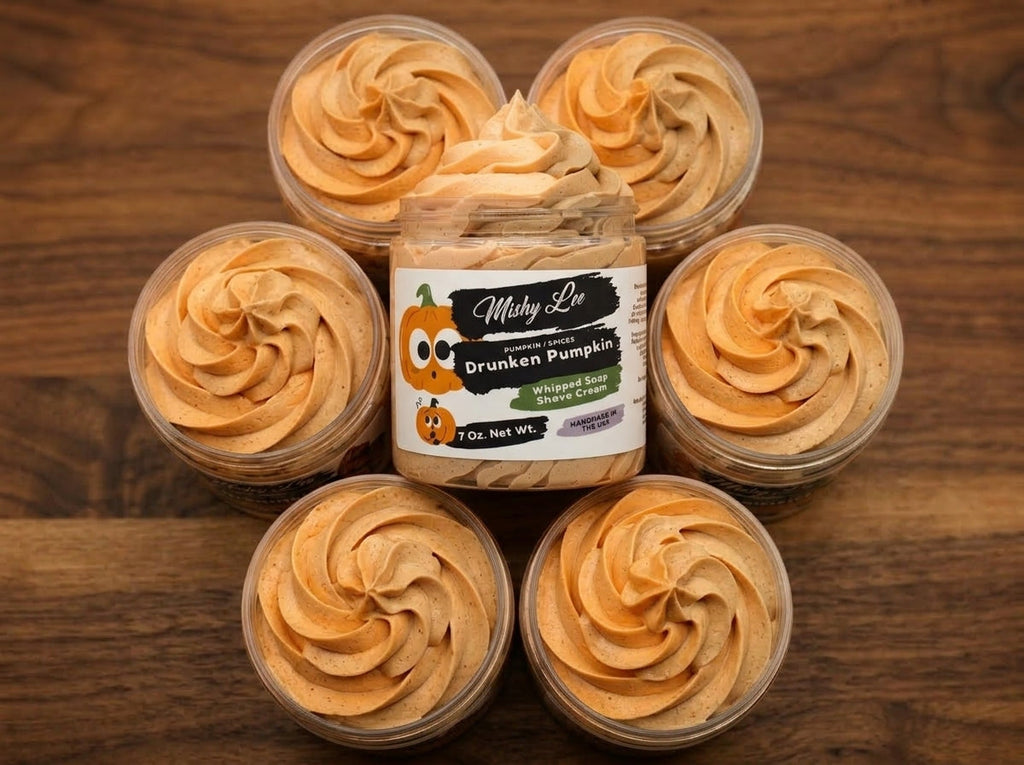 Set of five mini jars filled with orange whipped soap swirls