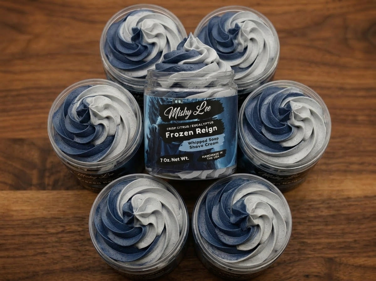 Whipped soap shave cream jar surrounded by small round whipped soap scoops
