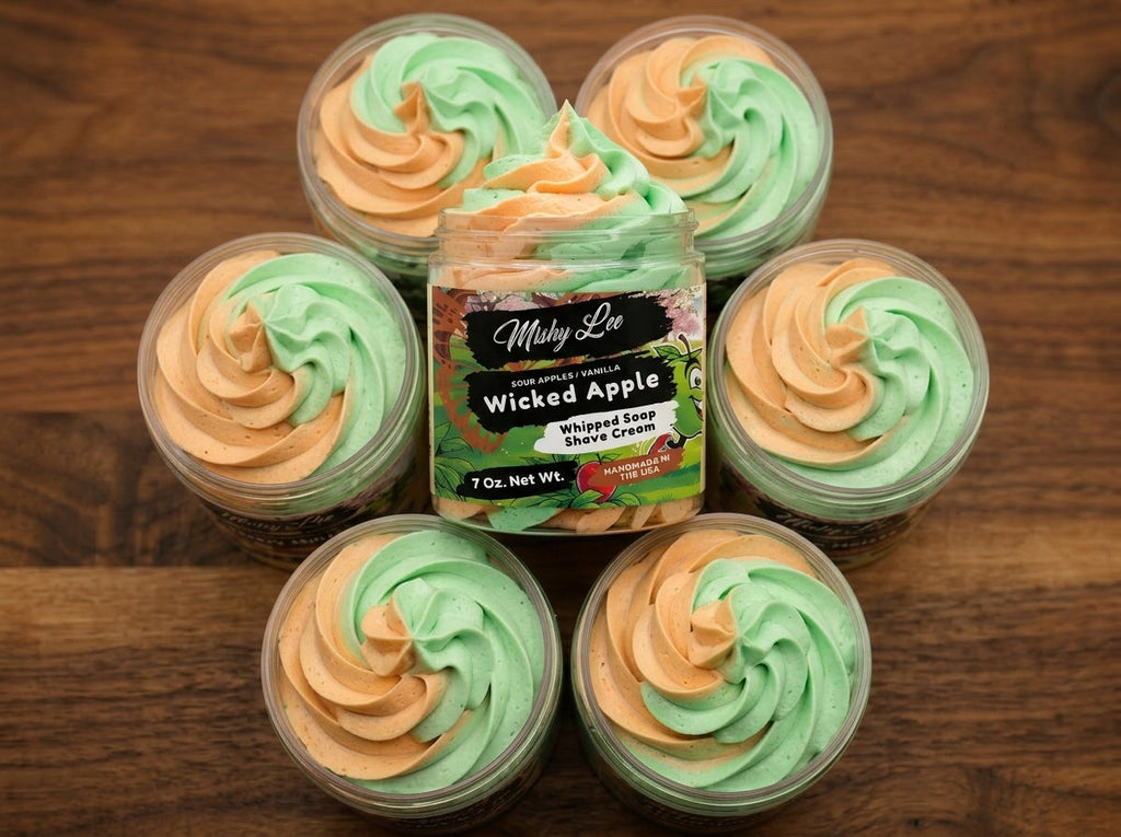 Whipped soap and shave cream set: jar plus multiple mini tubs with green and orange swirls.