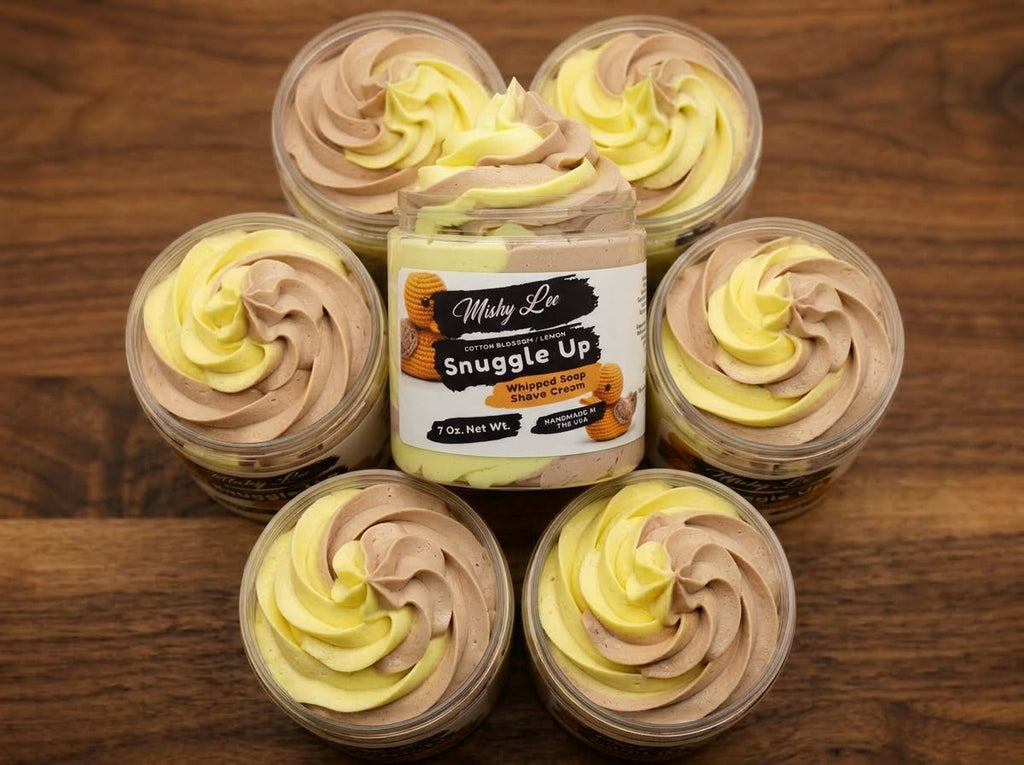 Set of whipped soap and shave cream mini jars with swirl tops in yellow and beige