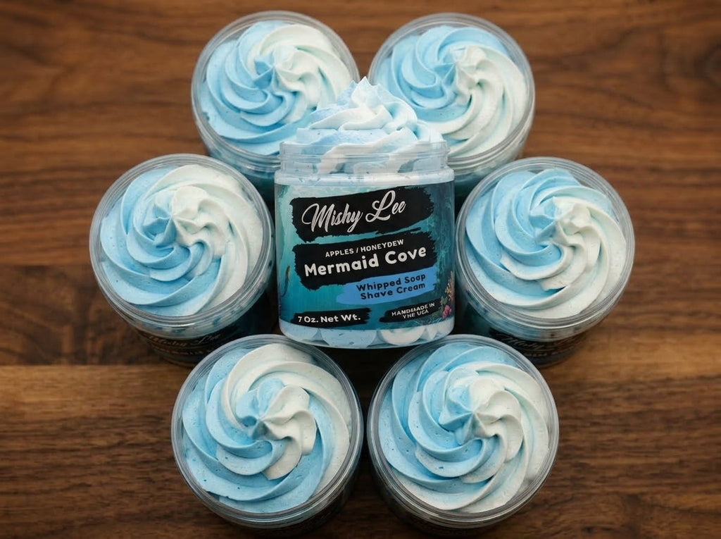 Small light blue whipped soap swirl containers arranged around a main jar.