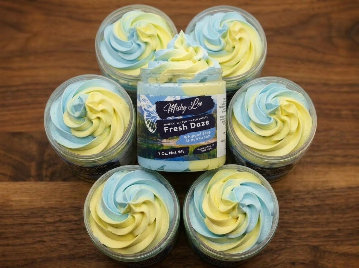 Set of mini whipped soap and shave cream jars with blue and yellow swirl tops
