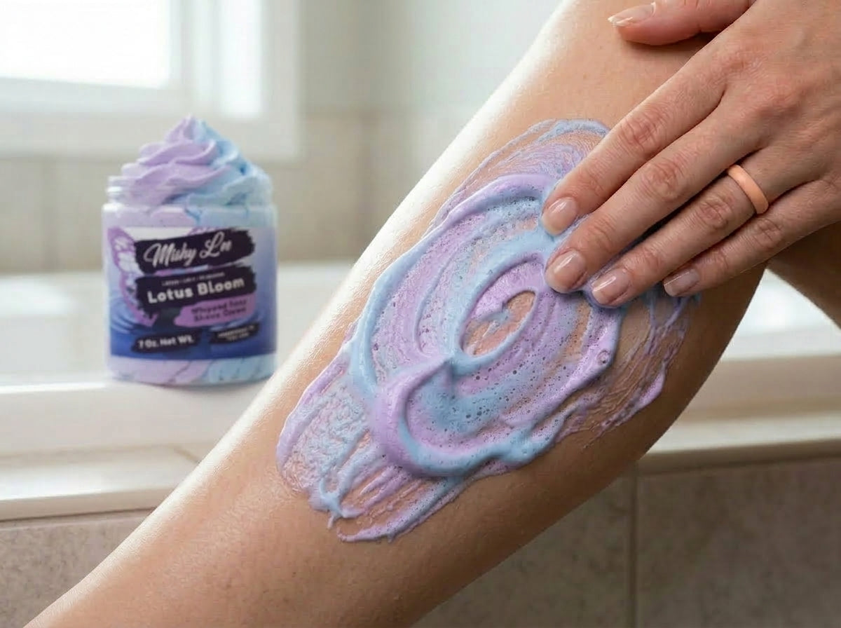Purple and blue whipped soap spread on skin from a Lotus Bloom jar