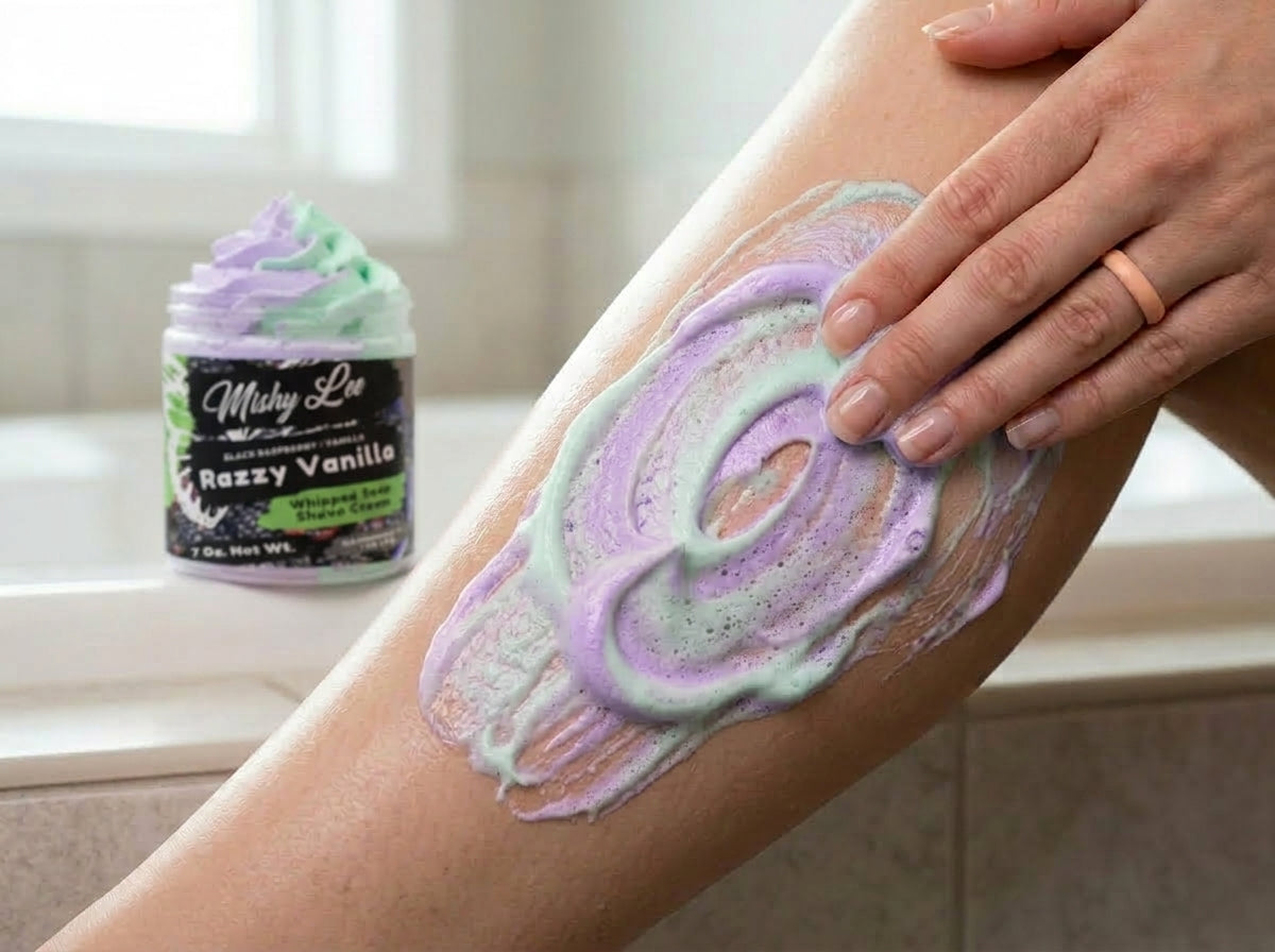 Purple and mint whipped soap smoothed on leg skin, jar visible in background