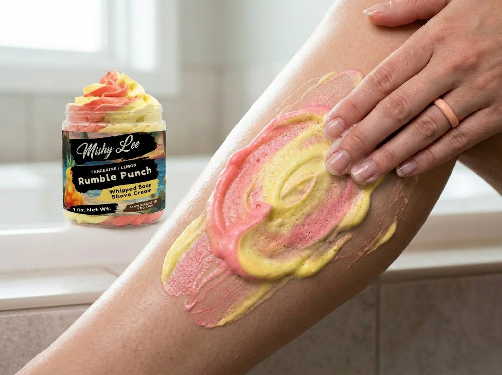 Whipped soap and shave cream lather on skin, layered pink and yellow tangerine-lemon