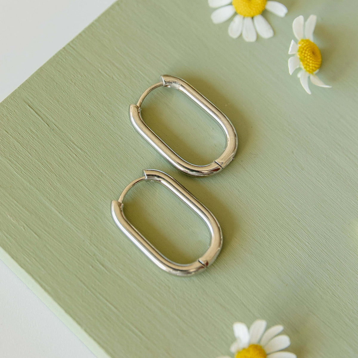 Silver rectangular hoop earrings, polished metal frames with hinge