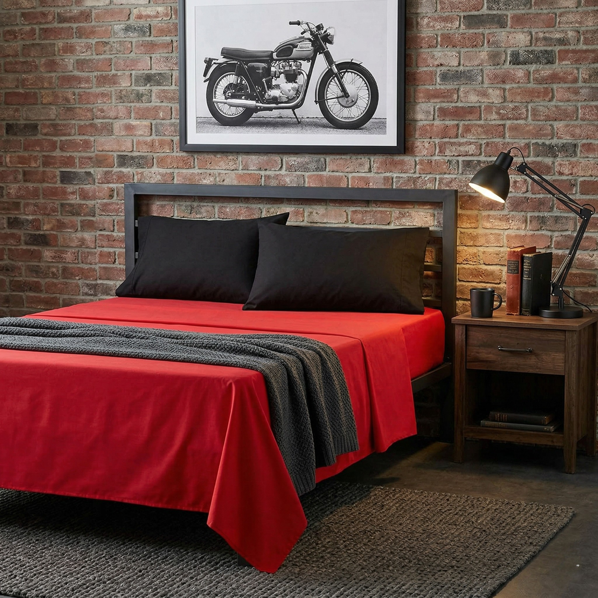 4-piece cotton sheet set with red bed sheet, black pillowcases, and gray striped throw