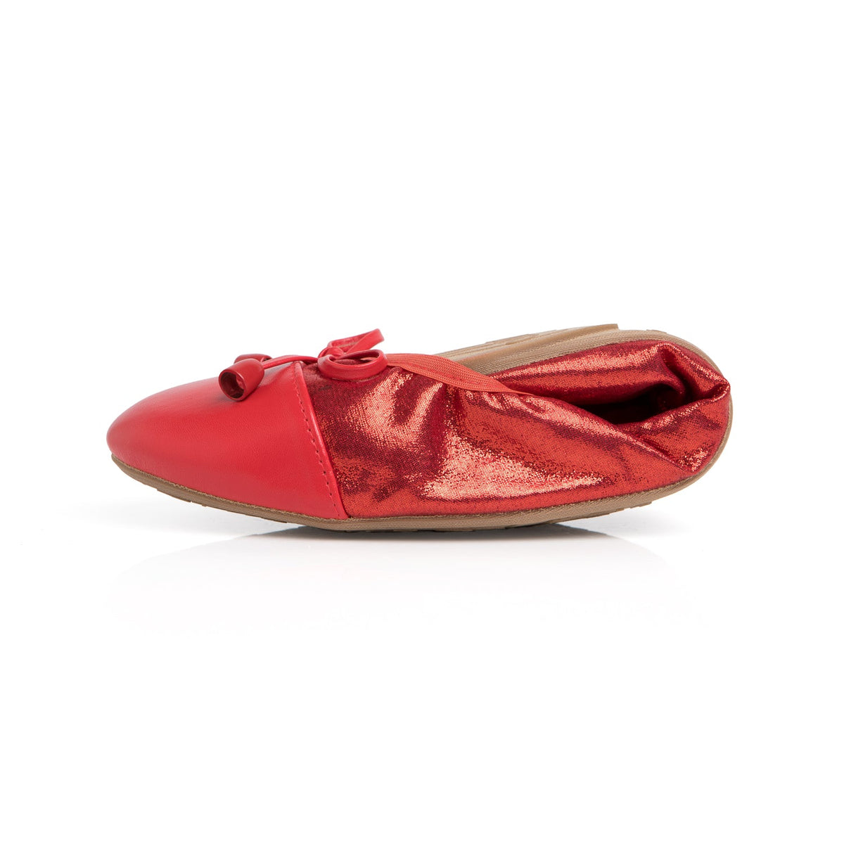 Ruby red metallic flats side view with lace bow detail and flexible sole.