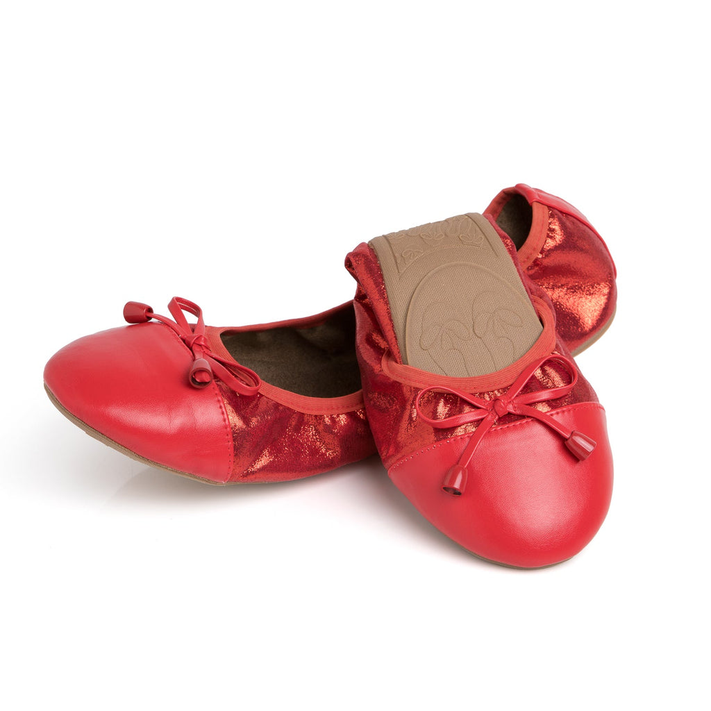 Ruby red metallic flats with lace-up bows, rounded toe, and cushioned footbed.