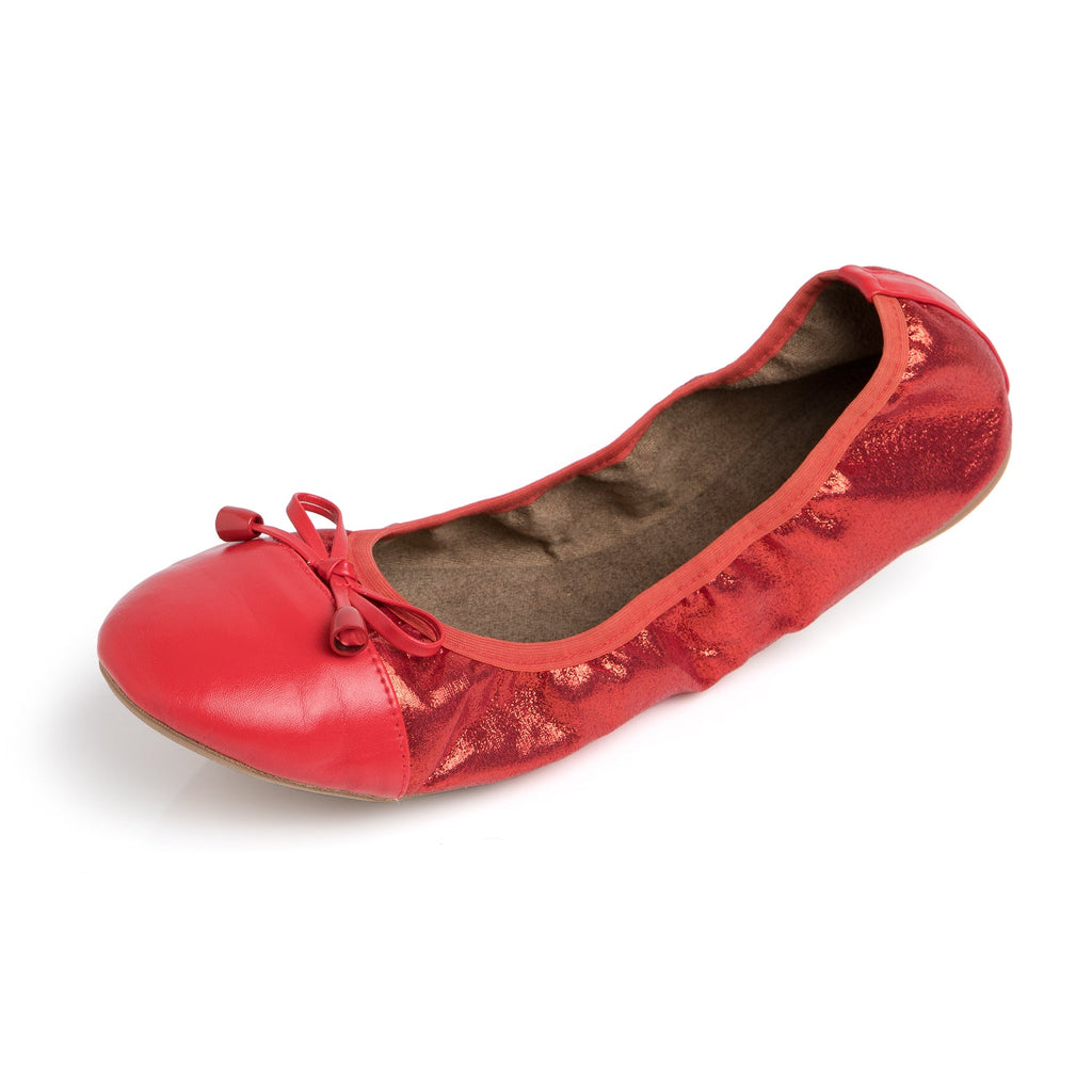 Ruby red metallic flats with lace-up bow and rounded toe, showing interior lining.