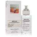 Eau de toilette spray bottle with clear glass and silver cap, shown with box