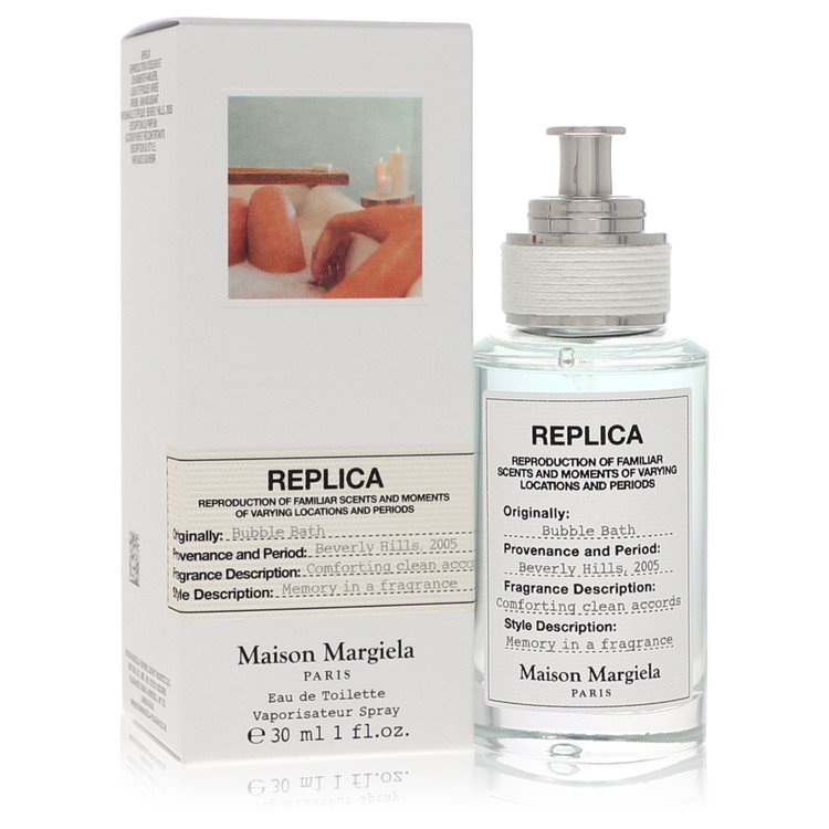 Eau de toilette spray bottle with clear glass and silver cap, shown with box