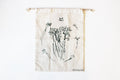 Off-white reusable cotton produce bag with botanical print and drawstring closure