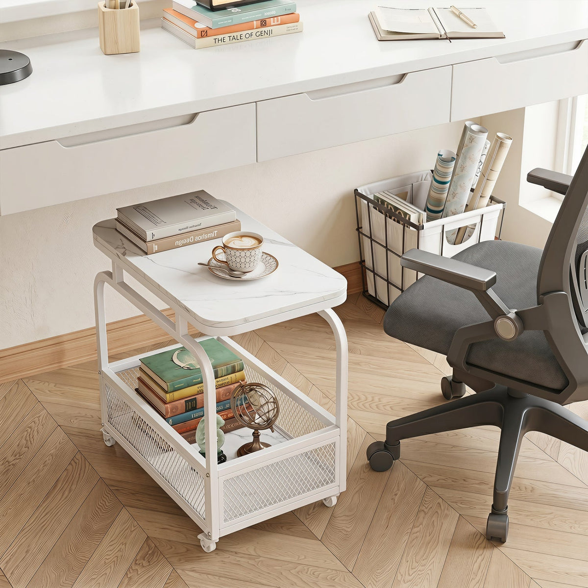 White rolling side table with faux marble top and lower mesh basket for books
