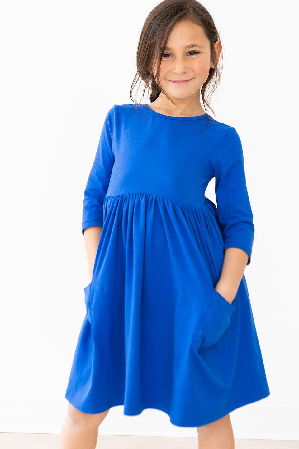 Royal blue pocket twirl dress with 3/4 sleeves and pleated gathered waist