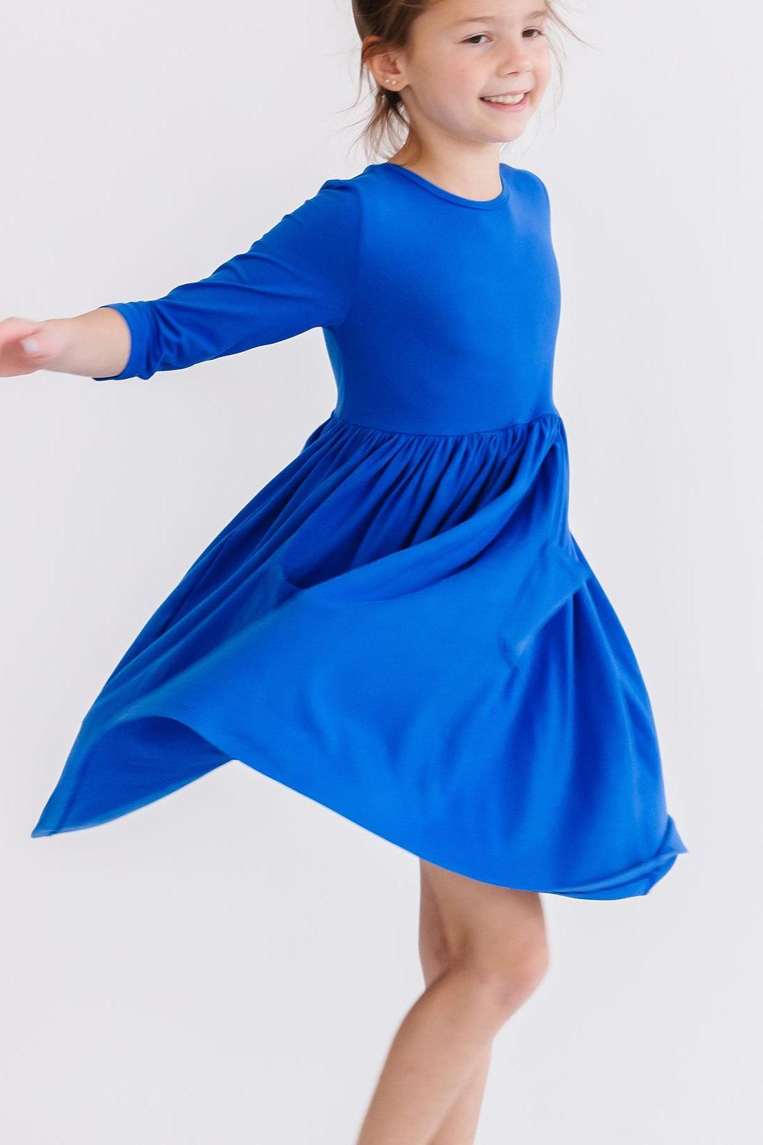 Royal blue twirl dress with 3/4 sleeves and flowing gathered skirt