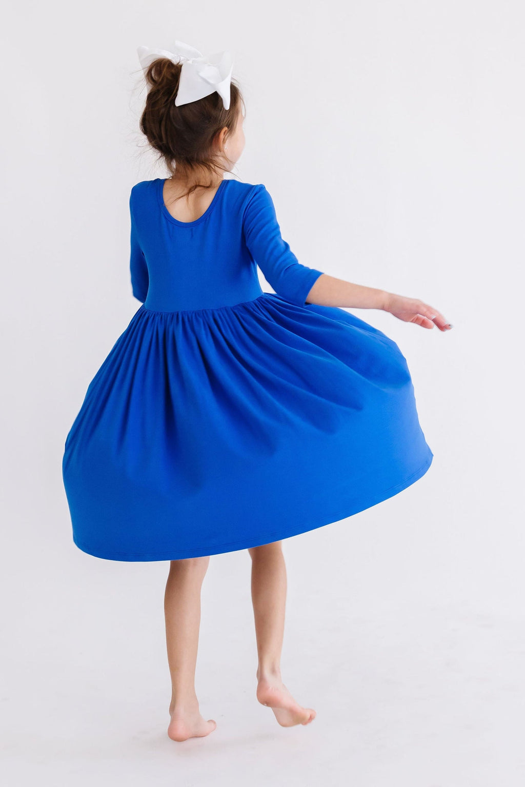 Royal blue pocket twirl dress with 3/4 sleeves and full twirl skirt