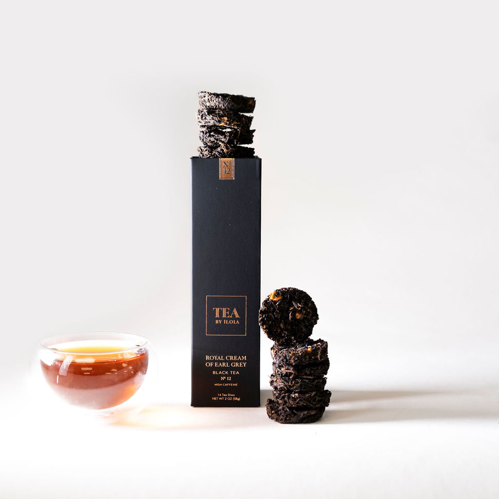 Earl Grey black tea discs with a box and a cup of brewed tea.