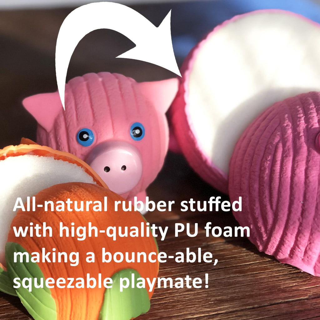Pink latex dog ball toy with blue eyes and a pig-like snout
