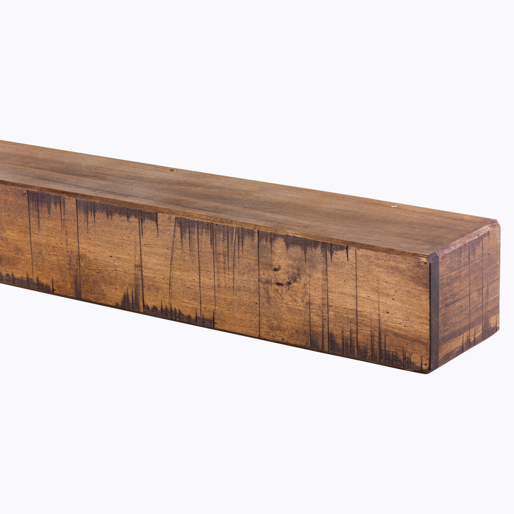 Fireplace mantel shelf in medium brown reclaimed-wood tone with plank seams and distressing.