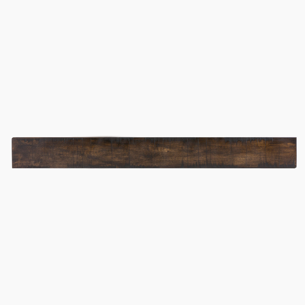 Fireplace mantel shelf with dark brown reclaimed-wood finish and weathered plank grain.