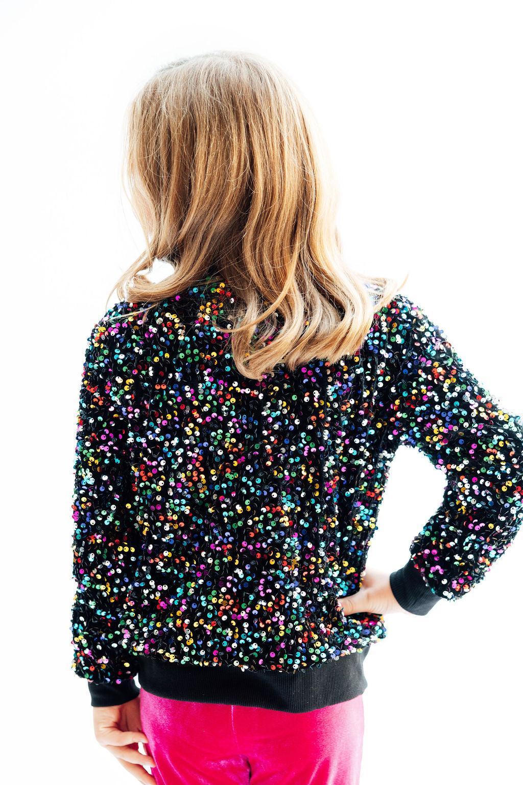 Girls' black confetti sequin velvet jacket, back view with zip front and ribbed cuffs
