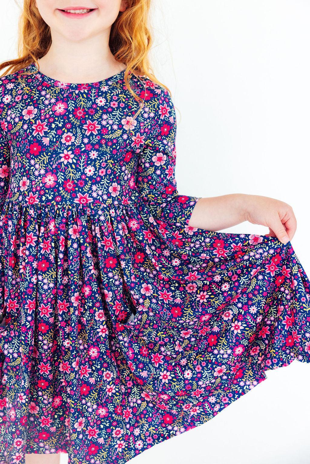 Floral twirl dress with 3/4 sleeves and side pockets, navy with pink and white flowers