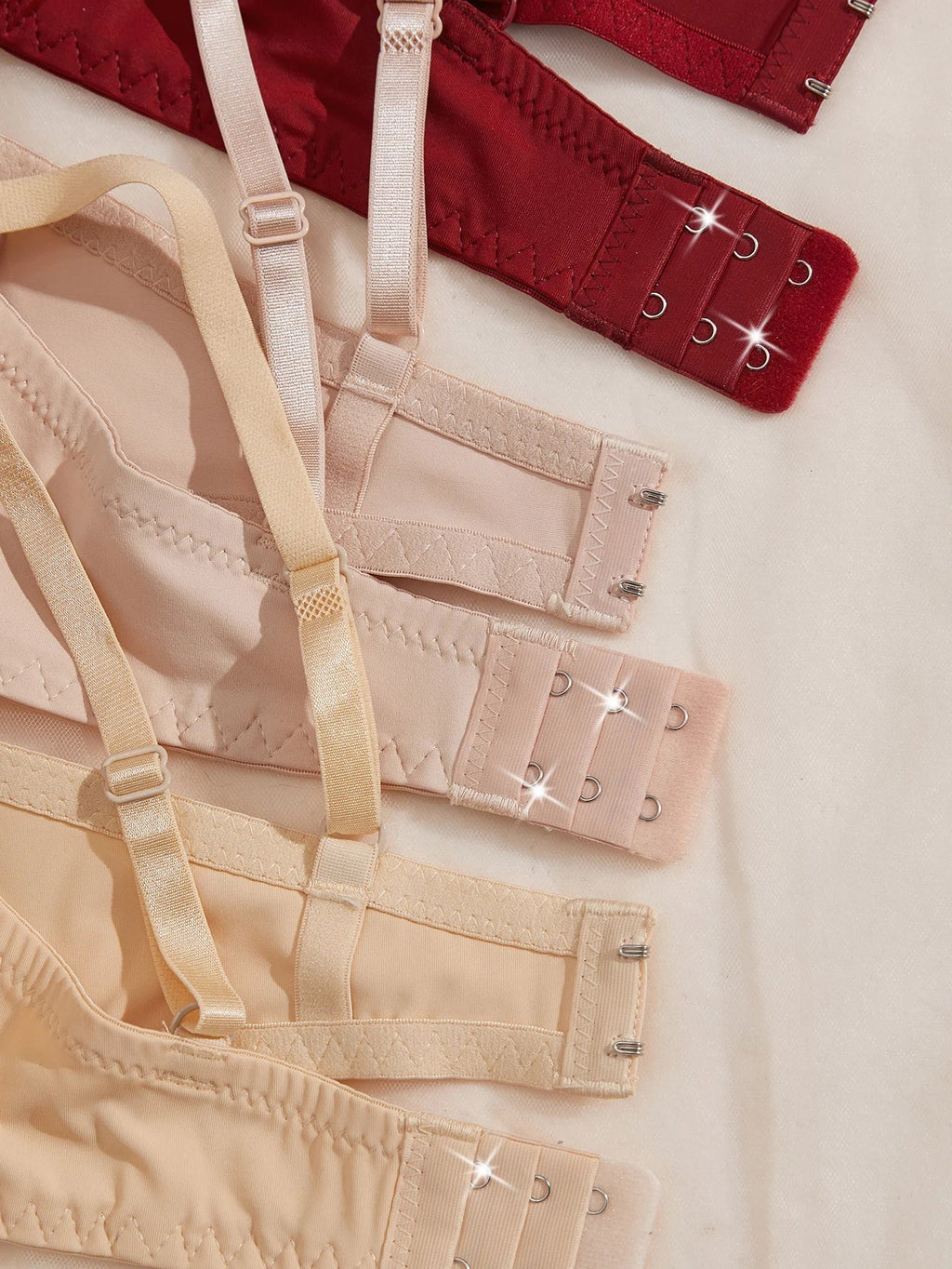 3-piece lace bra set showing back straps and hook-and-eye closures