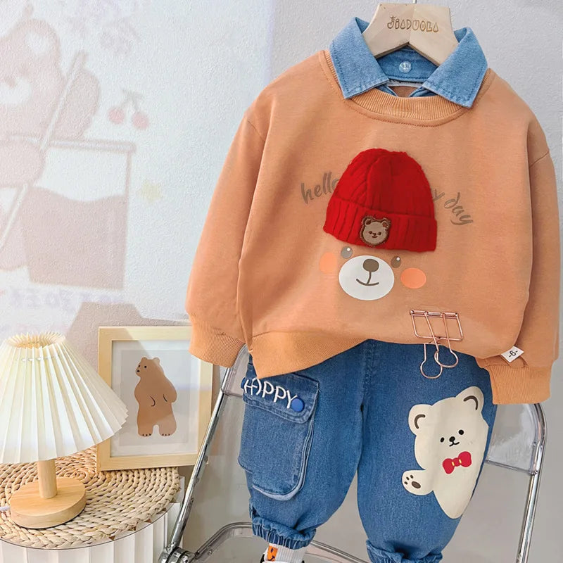 Peach sweatshirt with red beanie bear graphic and blue denim jogger pants set