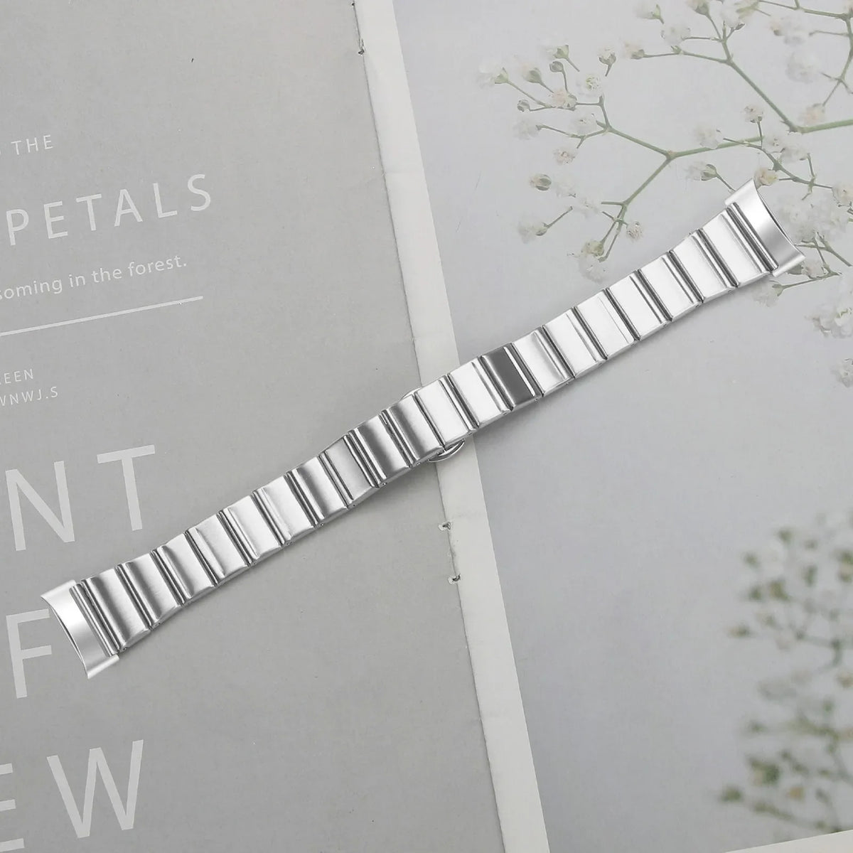 Silver stainless steel link band close-up with rectangular link bars