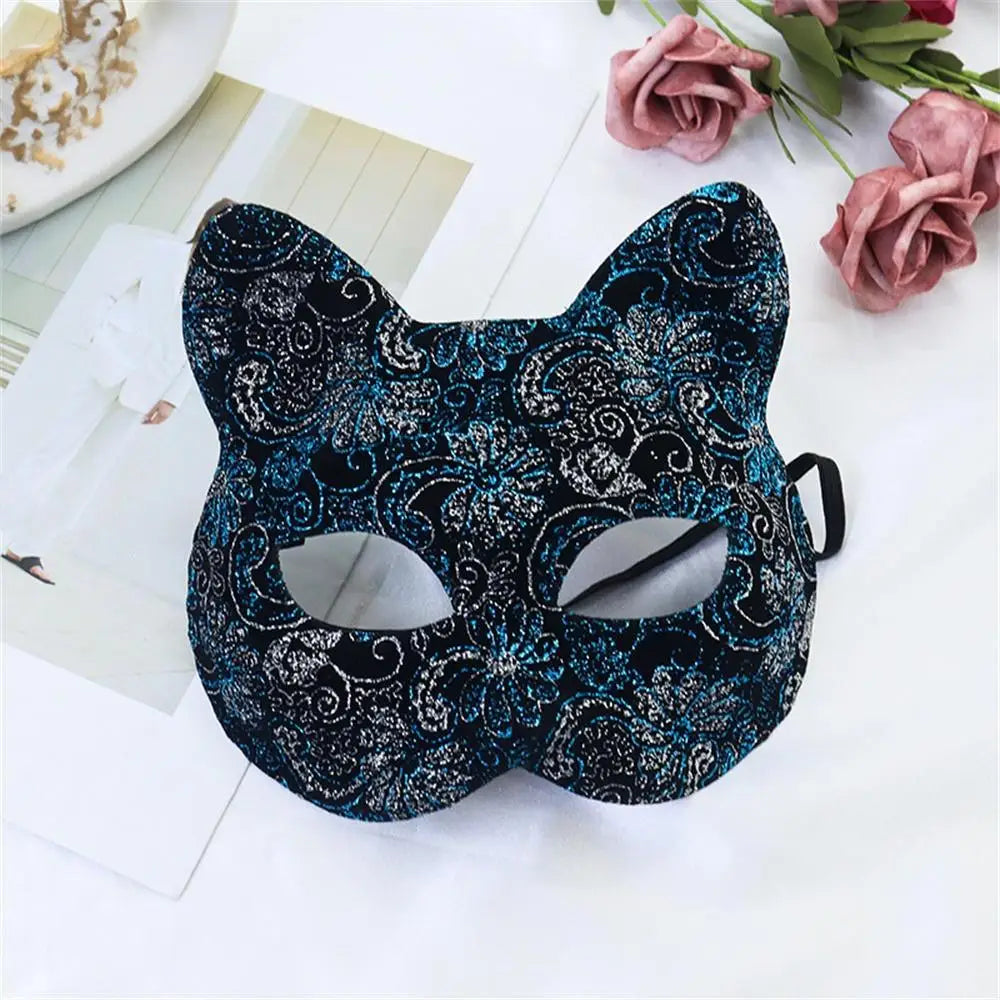 Blue patterned cat masquerade mask with glitter swirls, eye cutouts, ribbon ties