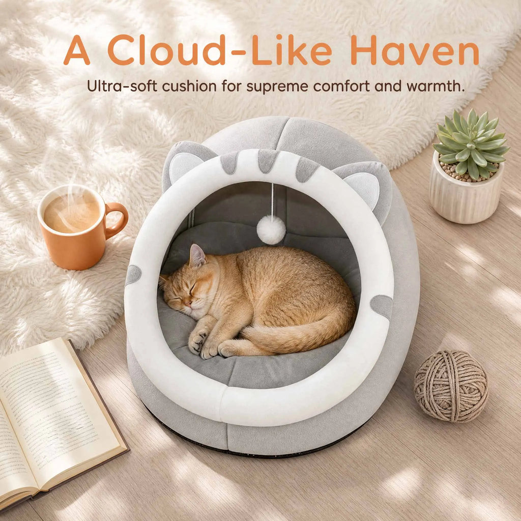 Gray covered cat bed cave tent with resting cat inside, white opening ring and pom-pom