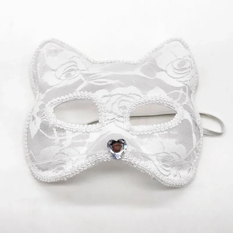White lace cat masquerade mask with heart jewel center and ribbon strap
