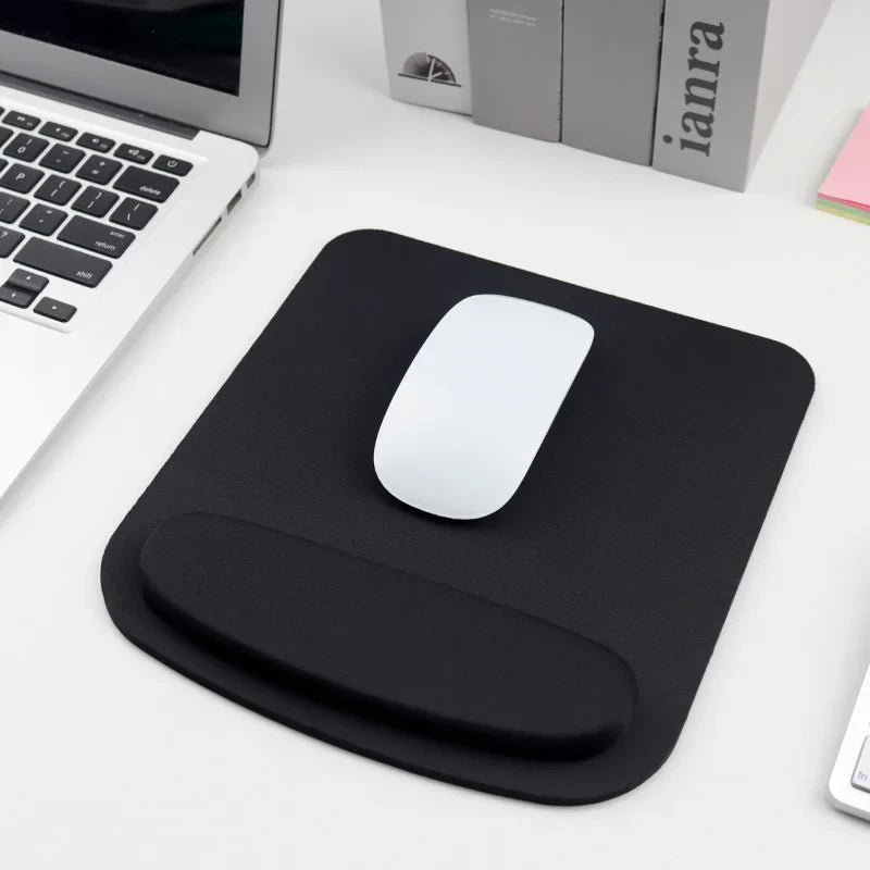 Black ergonomic mouse pad with integrated wrist rest and optical mouse