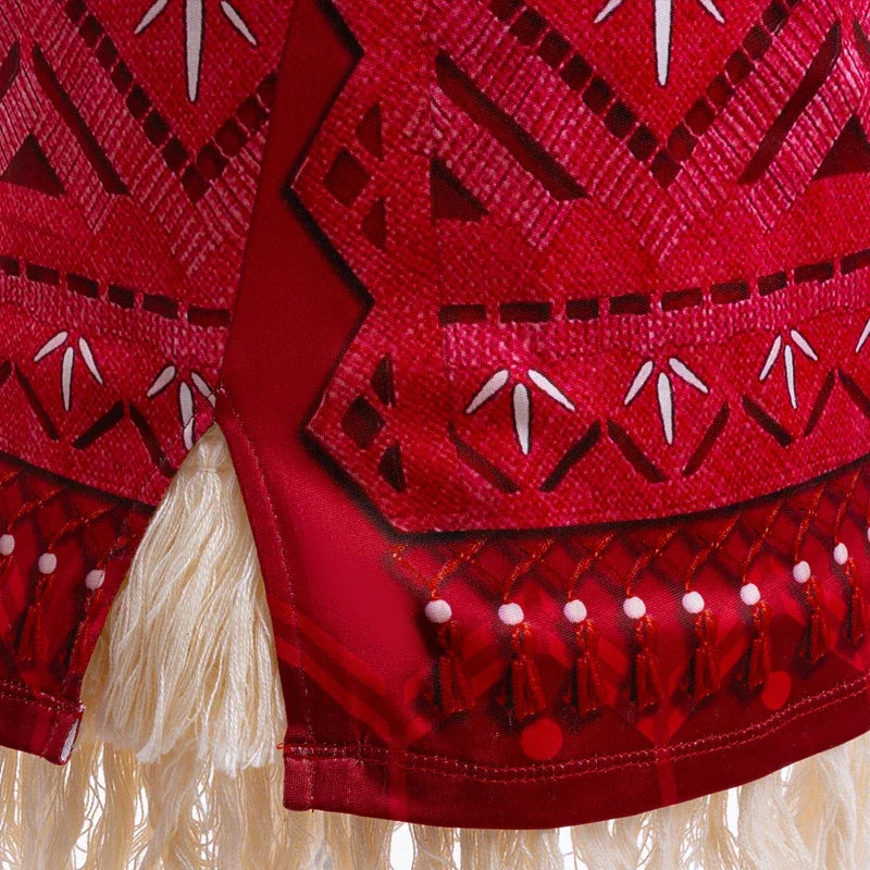 Close-up of red patterned skirt panel with bead fringe and faux fur edging