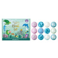 Ocean-themed bath bomb gift set box with 12 pastel round bath bombs