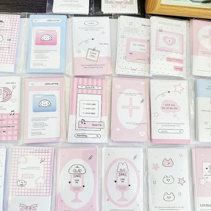 Grid of pastel pink and white seal sticker cards with hearts, stars, and small icons