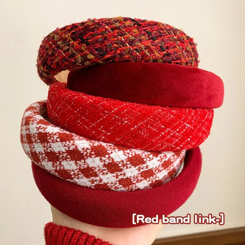 Stacked fabric headbands with red solid and white plaid patterns, wide bands.