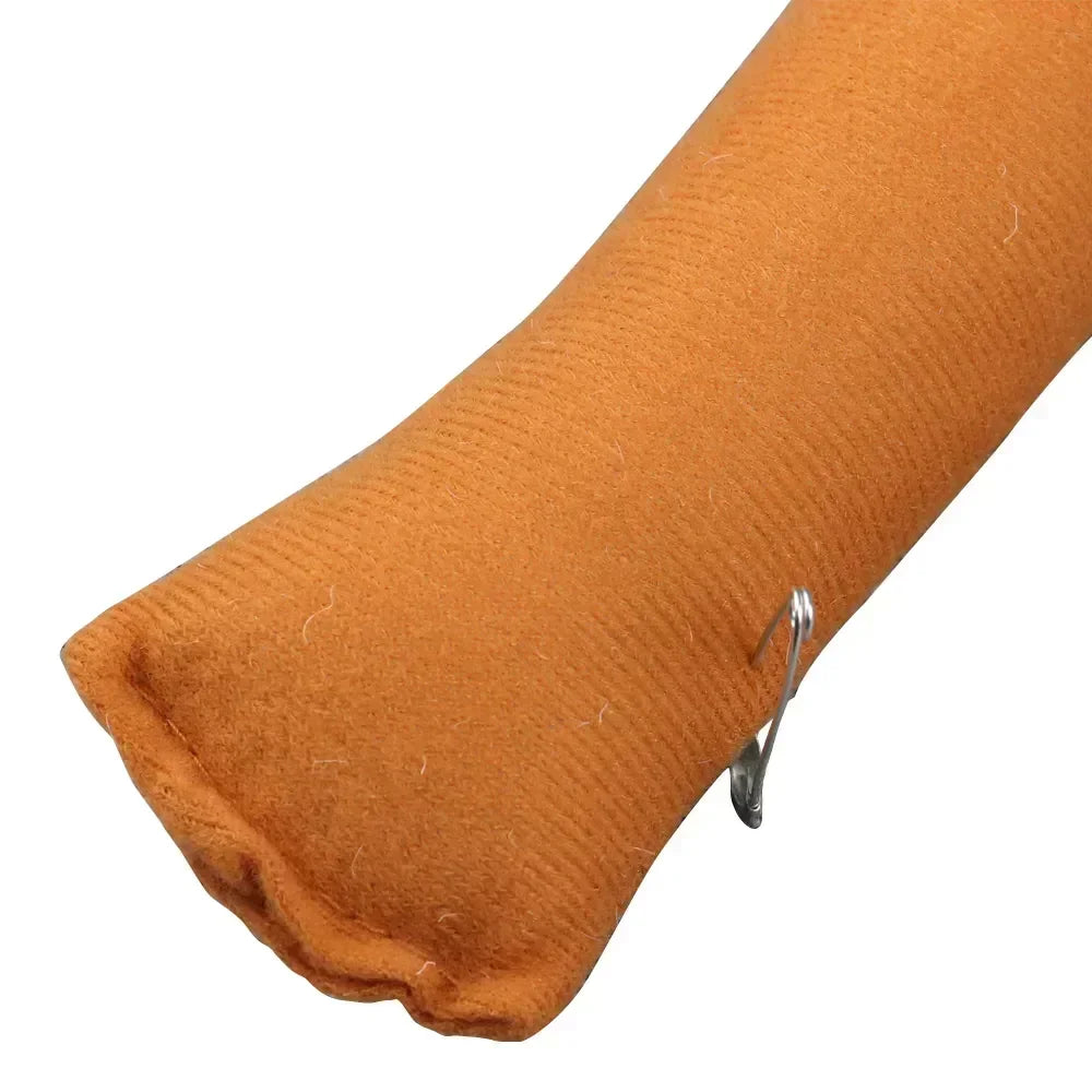 Brown fabric arm cover with stitched seam and small metal clip detail