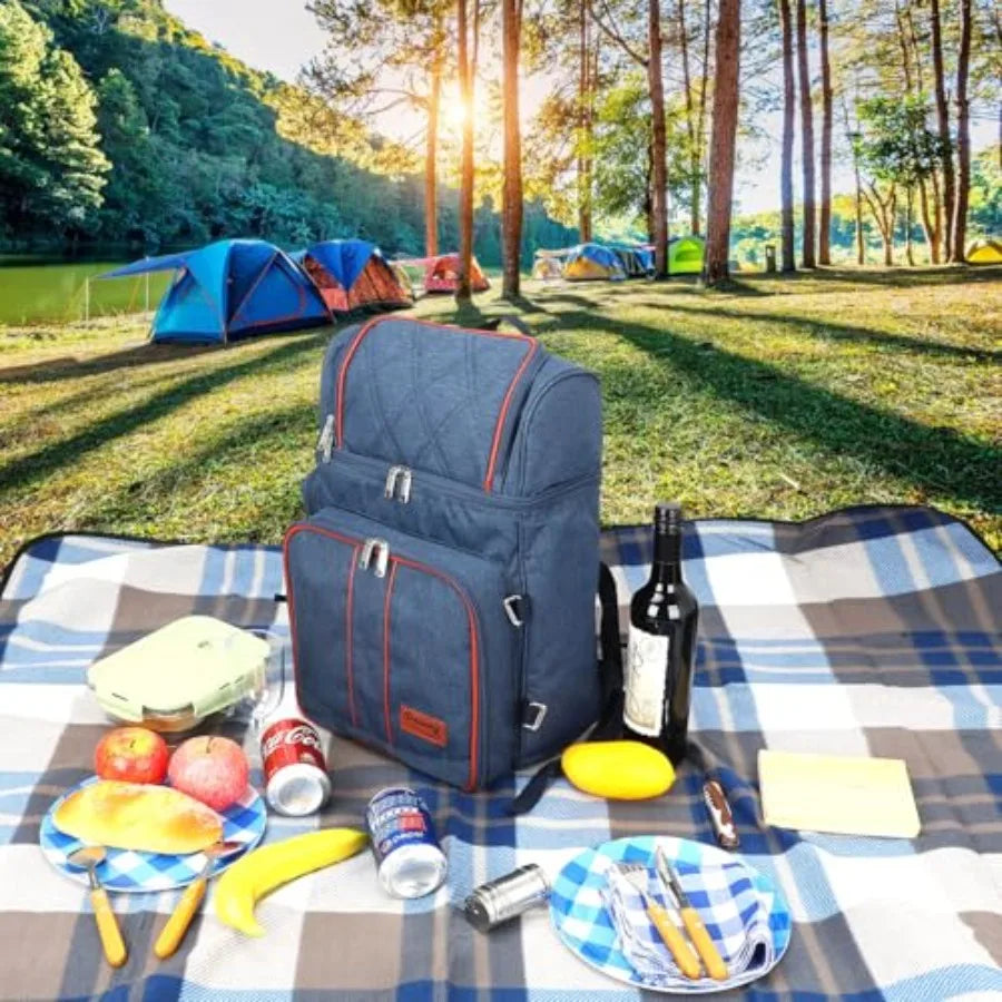 Blue picnic backpack cooler bag with bottle and checkered picnic items on blanket
